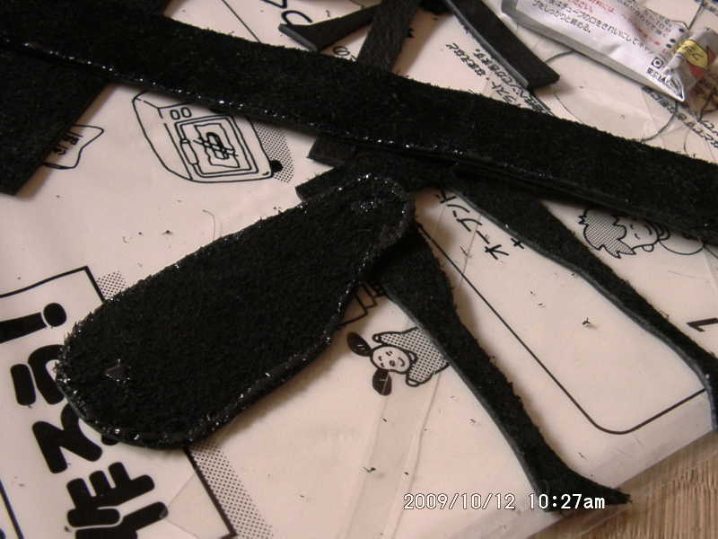 cutting the fake leather for case of the instrument shaped pottery object